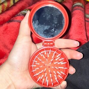 Compact Red Mirror and Brush